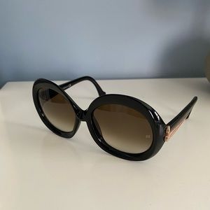 Balenciaga women’s sunglasses. Round frames, Black with gold tones on sides.